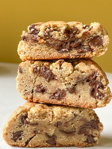 Stack of giant chocolate chip cookies.