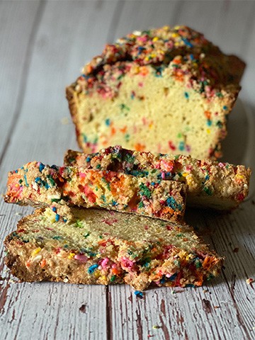 Rainbow bread with three slices hanging off
