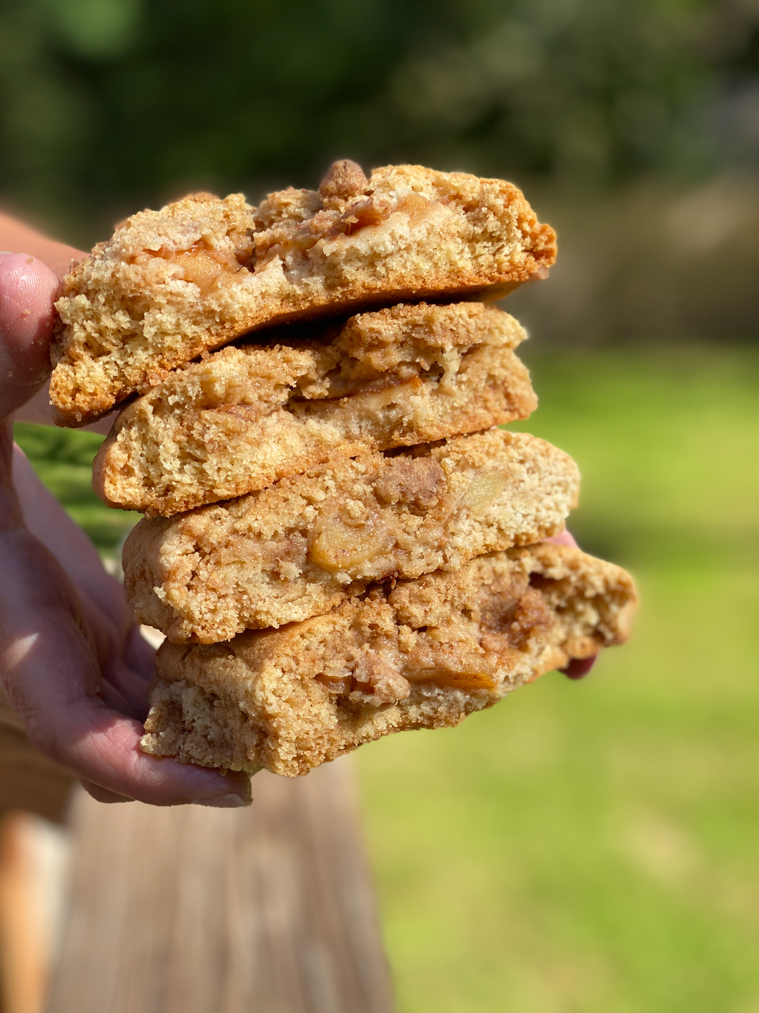 Apple Pie Cookies stacked on top of each other with the filling coming out. 