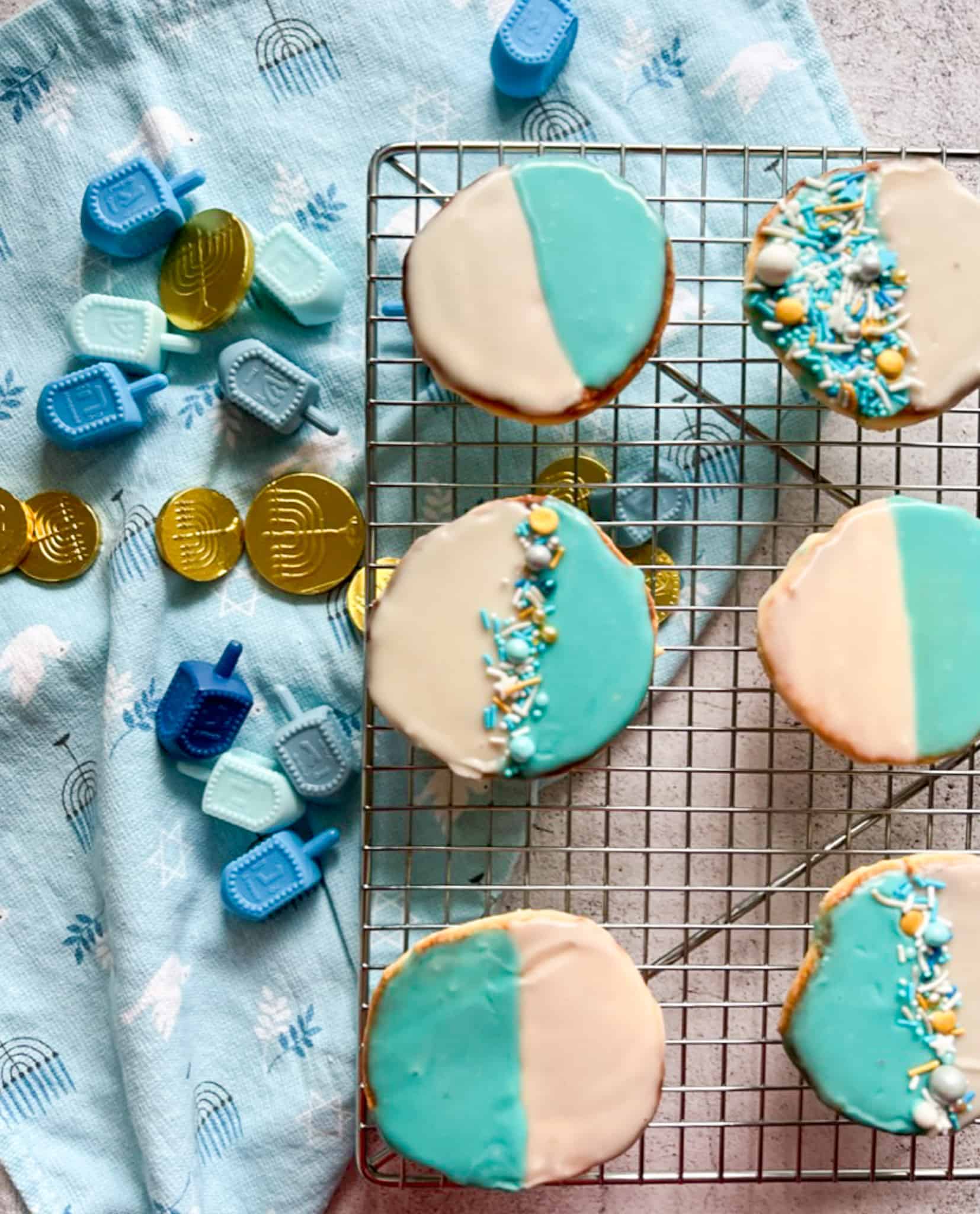 Blue and white cookies on rack