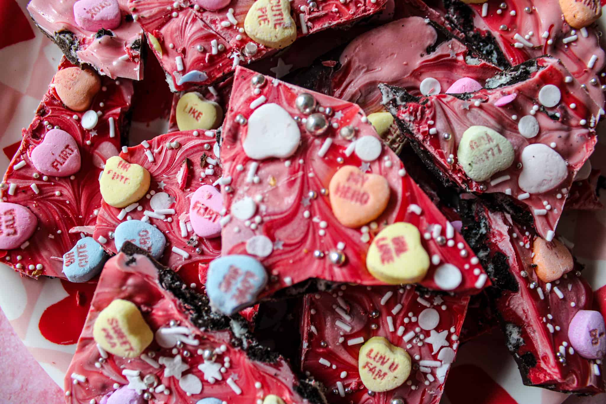 Close up of Valentine's Day chocolate bark with candy conversation hearts. 