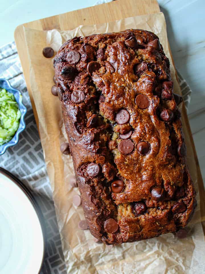 Chocolate Peanut Butter Zucchini Bread loaf on a wooden tray.