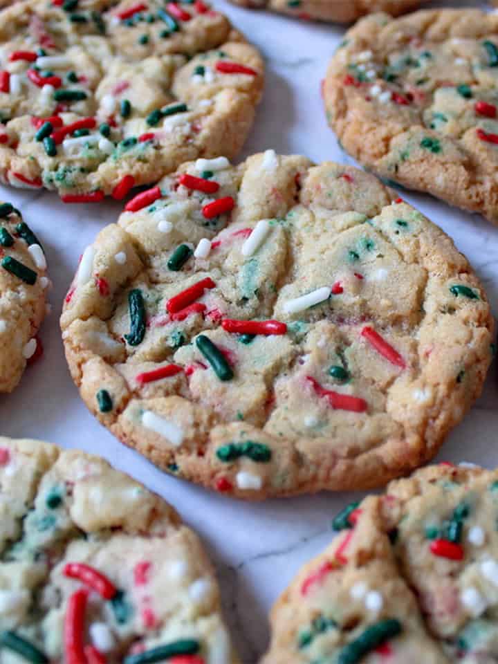 Cake mix Christmas sprinkle cookies next to a snowflake Christmas ornament.
